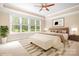 Furnished bedroom with large windows, a bed, and neutral tones at 3204 Mcpherson St, Waxhaw, NC 28173
