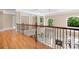 Bright foyer with hardwood floors and wrought iron railing overlooking the entry and living room at 3204 Mcpherson St, Waxhaw, NC 28173