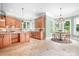 A gourmet kitchen with island, stainless appliances, and cozy dining area at 3204 Mcpherson St, Waxhaw, NC 28173