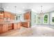 A gourmet kitchen with island, stainless appliances, and plenty of natural light at 3204 Mcpherson St, Waxhaw, NC 28173