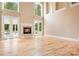 A bright living room with a fireplace and French doors at 3204 Mcpherson St, Waxhaw, NC 28173