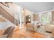 Bright living room with hardwood floors, large staircase and a seating area at 3204 Mcpherson St, Waxhaw, NC 28173