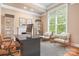 Bright home office featuring large window, desk, shelves and chairs at 3204 Mcpherson St, Waxhaw, NC 28173