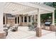 Spacious outdoor patio with a pergola, built-in grill, and dining area, ideal for entertaining at 3204 Mcpherson St, Waxhaw, NC 28173