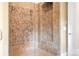 Walk-in shower with tile walls, glass door, and a built-in bench at 3204 Mcpherson St, Waxhaw, NC 28173