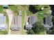 Bird's-eye view of multiple homes with well-maintained roofs and green surroundings showing a peaceful and established community at 3209 Lowell Rd, Gastonia, NC 28054