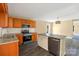 Bright, modern kitchen with granite counters, stainless appliances, and hardwood flooring at 3209 Lowell Rd, Gastonia, NC 28054
