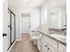 Well-lit bathroom featuring granite countertops, a walk-in shower, and access to a walk-in closet at 3323 Burberry Dr, Gastonia, NC 28052