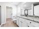Elegant bathroom with granite countertops, white cabinets, and a modern black framed shower at 3323 Burberry Dr, Gastonia, NC 28052