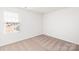 Comfortable bedroom featuring a large window, soft carpeting, and neutral paint, creating a calming retreat at 3323 Burberry Dr, Gastonia, NC 28052