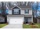 Charming two-story home features a two-car garage, stylish siding, and well-maintained landscaping at 3323 Burberry Dr, Gastonia, NC 28052