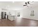 Modern kitchen featuring stainless steel appliances, an island, and seamless access to the living area at 3323 Burberry Dr, Gastonia, NC 28052