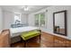 Bright bedroom features a large window for natural light and hardwood floors at 34 Admiral Sw Ave, Concord, NC 28027