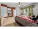 Bedroom with wood paneled accent wall and neutral carpet floors at 34 Admiral Sw Ave, Concord, NC 28027