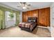Comfortable bedroom with wood paneling and carpet floors at 34 Admiral Sw Ave, Concord, NC 28027