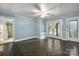 Versatile bonus room with tiled floor, built-in shelves and access to the backyard at 34 Admiral Sw Ave, Concord, NC 28027