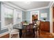 Bright dining area featuring hardwood floors and a view to the bedroom at 34 Admiral Sw Ave, Concord, NC 28027