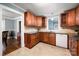 Kitchen showcasing tile backsplash, wooden cabinets and granite countertops at 34 Admiral Sw Ave, Concord, NC 28027