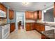 A functional kitchen with plenty of cabinet space and stainless steel appliances at 34 Admiral Sw Ave, Concord, NC 28027