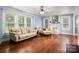 Bright living room with hardwood floors, complemented by a decorative fireplace and ample natural light at 34 Admiral Sw Ave, Concord, NC 28027