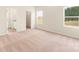 Bedroom features bright light, neutral carpet, and views of the property at 3475 Saddlebred Dr, Gastonia, NC 28052