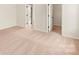 Bedroom features neutral carpet, two closets, and a bright, open feel at 3475 Saddlebred Dr, Gastonia, NC 28052