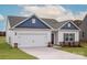 Charming single-Gathering home with a two-car garage, attractive landscaping, and inviting curb appeal at 3475 Saddlebred Dr, Gastonia, NC 28052