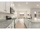Open concept kitchen features stainless appliances, granite counters and bright view out back at 3475 Saddlebred Dr, Gastonia, NC 28052
