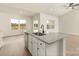 Open concept kitchen island features granite countertops, stainless appliances and bright, open floorplan at 3475 Saddlebred Dr, Gastonia, NC 28052