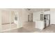 Open-concept living space with a kitchen island, stainless steel appliances, and lots of natural light at 3475 Saddlebred Dr, Gastonia, NC 28052