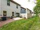 Fenced backyard has a small patio area and grassy lawn at 403 Park Meadows Dr, Matthews, NC 28104