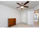 An upstairs bedroom with a ceiling fan, carpet, neutral walls, and a closet at 403 Park Meadows Dr, Matthews, NC 28104