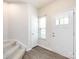 Bright entryway boasting fresh paint, stairs, and wood-look flooring at 403 Park Meadows Dr, Matthews, NC 28104