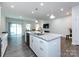 Modern kitchen with granite island, stainless steel appliances, and open floor plan perfect for entertaining at 403 Park Meadows Dr, Matthews, NC 28104