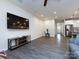 Spacious living room with a large television, comfortable seating and a kitchen view, ideal for gatherings at 403 Park Meadows Dr, Matthews, NC 28104