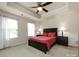 A cozy main bedroom featuring neutral walls, a ceiling fan, bedside lamps, and two windows to allow for plenty of natural light at 403 Park Meadows Dr, Matthews, NC 28104