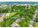 Aerial shot showing the property in a neighborhood with mature trees and green spaces at 409 Scaleybark Rd, Charlotte, NC 28209