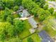 Aerial view of the property showing the yard, neighborhood, and surrounding greenery at 409 Scaleybark Rd, Charlotte, NC 28209