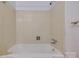 This bathroom has a white tiled shower and tub with chrome hardware at 409 Scaleybark Rd, Charlotte, NC 28209