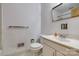 Bathroom featuring a white vanity, mirror, faucet, and toilet at 409 Scaleybark Rd, Charlotte, NC 28209