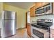 Kitchen with stainless steel refrigerator, stove, and built-in microwave at 409 Scaleybark Rd, Charlotte, NC 28209