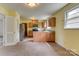 Eat-in kitchen with stainless steel appliances, ample counter space, and wood cabinets at 409 Scaleybark Rd, Charlotte, NC 28209