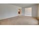 Living room features carpet, neutral walls, and doorway leading to other rooms at 409 Scaleybark Rd, Charlotte, NC 28209