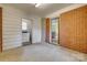 Mud room featuring washer/dryer hookups, brick accent wall, and access to the backyard at 409 Scaleybark Rd, Charlotte, NC 28209