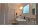 Bright bathroom featuring a freestanding tub, double vanity, and a modern design with clean lines and neutral tones at 4710 Old Pageland Marshville Rd, Monroe, NC 28112