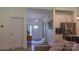Spacious foyer featuring white walls, a stylish console table, and easy access to both the front door and the kitchen at 4710 Old Pageland Marshville Rd, Monroe, NC 28112
