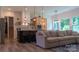 Comfortable living space with a modern kitchen featuring stylish fixtures, bar seating, and a cozy living room area at 4710 Old Pageland Marshville Rd, Monroe, NC 28112