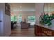 Open living space with wood floors, a comfortable sofa, bar seating, bright windows, and sliding glass doors to the deck at 4710 Old Pageland Marshville Rd, Monroe, NC 28112