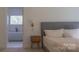 Bedroom with a comfortable bed, and a bathroom with a soaking tub visible through the doorway at 4710 Old Pageland Marshville Rd, Monroe, NC 28112