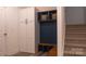 Mudroom featuring a custom built-in storage unit with hooks, baskets, and bench seating at 4710 Old Pageland Marshville Rd, Monroe, NC 28112